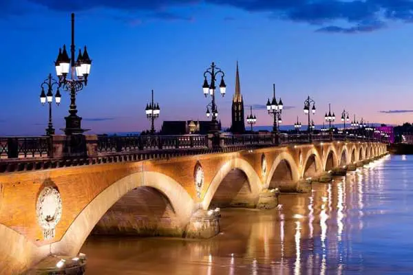 A night-time view of the beautiful Pont de Pierre